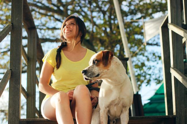 Lady with dog on steps